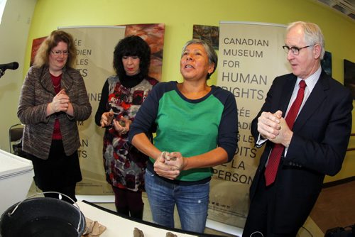 Local artist Rebecca Belmore(in green) with L-R Mary Reid, Lee-Ann Martin, and (R) Stuart Murray at Neechi Commons. New art installation announcement for the Human Rights Museum. BORIS MINKEVICH / WINNIPEG FREE PRESS. JAN 23, 2014