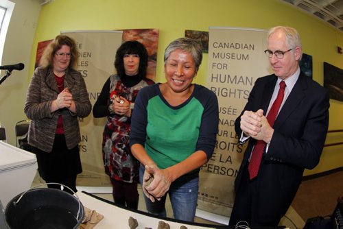 Local artist Rebecca Belmore(in green) with L-R Mary Reid, Lee-Ann Martin, and (R) Stuart Murray at Neechi Commons. New art installation announcement for the Human Rights Museum. BORIS MINKEVICH / WINNIPEG FREE PRESS. JAN 23, 2014