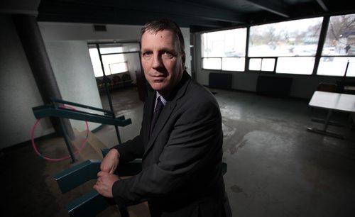Floyd Perras, executive director of Siloam has a $8.5 million expansion plan for the site around their present building. He's posing here in a Stanley Street building (behind their existing Princess Street Facility)that will house their front line services and an assisted living ceter.   January 24, 2014 - (Phil Hossack / Winnipeg Free Press)