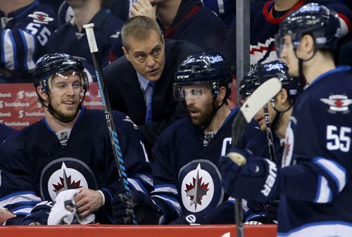 Winnipeg Jets head coach Paul Maurice talks to Bryan Little (18) and Andrew Ladd (16) on the bench as the team plays the Toronto Maple Leafs' during second period NHL hockey action at MTS Centre in Winnipeg, Saturday, January 25, 2014. (TREVOR HAGAN/WINNIPEG FREE PRESS)