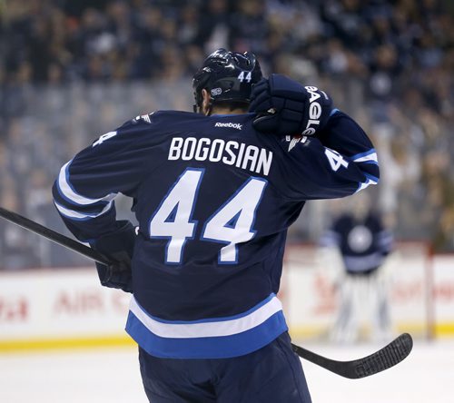 Winnipeg Jets' Zach Bogosian (44) celebrates by taking the monkey off his back after he scored against the Toronto Maple Leafs' during second period NHL hockey action at MTS Centre in Winnipeg, Saturday, January 25, 2014. (TREVOR HAGAN/WINNIPEG FREE PRESS)