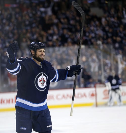 Winnipeg Jets' Zach Bogosian (44) celebrates after he scored against the Toronto Maple Leafs' during second period NHL hockey action at MTS Centre in Winnipeg, Saturday, January 25, 2014. (TREVOR HAGAN/WINNIPEG FREE PRESS)