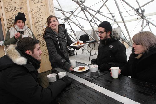 Brookelyn Herszkop serves up some brunch nosh at the River Pop-up restaurant located on the Assiniboine River at The Forks.  140126 - January 26, 2014 MIKE DEAL / WINNIPEG FREE PRESS