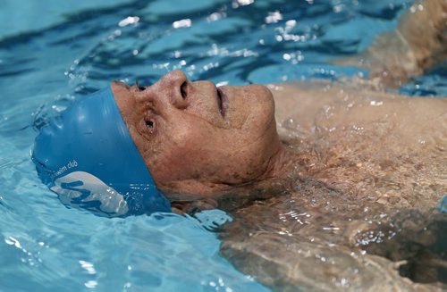 Jaring Timmerman, 105, during his 50m backstroke heat during the Catherin Kerr Pentathlon at the Pan Am Pool, Friday, January 24, 2014. (TREVOR HAGAN/WINNIPEG FREE PRESS)