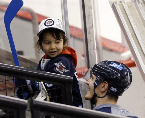 Stdup - Hard to tell who is more thrilled , Jets  MarkScheifele  signs jersey  and stick of  athrilled Jace Ryder  age 3  at the Jets game day skate , Jace  is visiting with his family from Saskatoon  and were able to watch the  team prepare for tonights (tuesday)  game with the Nashville Predators JAN. 28 2014 / KEN GIGLIOTTI / WINNIPEG FREE PRESS