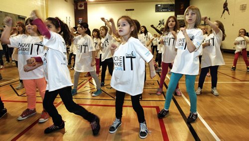 About 120 students at Heritage Elementary School gathered to dance to hip hop, funky jazz and zumba for an entire afternoon to promote getting active and raise money for the Heart and Stroke Foundation. 140128 - January 28, 2014 MIKE DEAL / WINNIPEG FREE PRESS