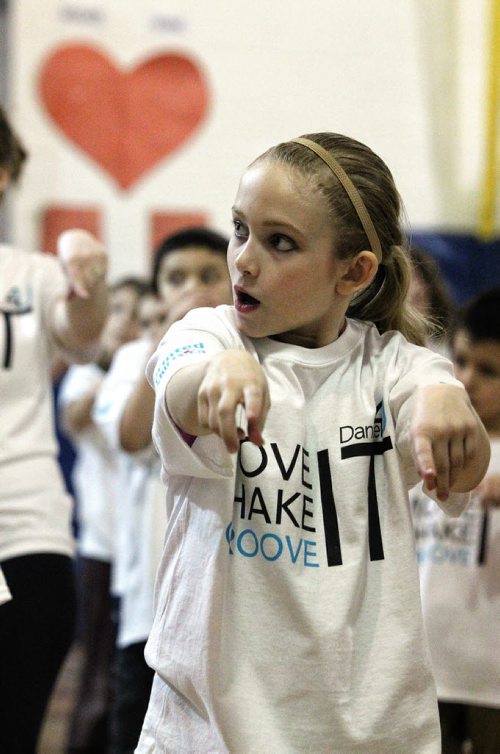 Kaylee Dobson, 10, and about 120 students at Heritage Elementary School gathered to dance to hip hop, funky jazz and zumba for an entire afternoon to promote getting active and raise money for the Heart and Stroke Foundation. 140128 - January 28, 2014 MIKE DEAL / WINNIPEG FREE PRESS