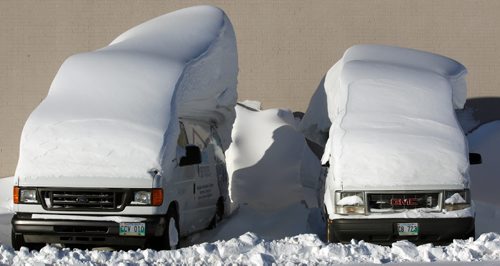 Snow Brush Required- Service trucks covered in massive snow drifts at the Sears at 1725 Inkster Blvd   Standup photo- Jan 28, 2014   (JOE BRYKSA / WINNIPEG FREE PRESS). weather