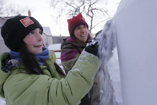 January 28, 2014 - 140128  - Heidi Zechel (10) and Christel Lanthier make a snow carving at the Canadian Mental Health Association festivities at the Clara Hughes Recreation Park Tuesday, January 28, 2014. John Woods / Winnipeg Free Press