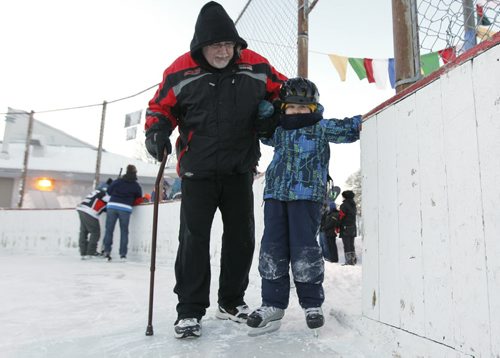 January 28, 2014 - 140128  - Five year old Michael Fullerton takes his first steps on skates with his grandfather Tim McQuade at the Canadian Mental Health Association festivities at the Clara Hughes Recreation Park Tuesday, January 28, 2014. John Woods / Winnipeg Free Press
