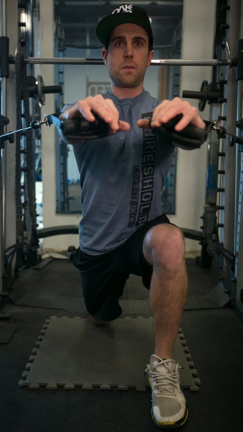 Tim Shantz demonstrates a chest press on one knee to engage lower body and core to fight gravity during the exercise. 140128 - Tuesday, {month name} 28, 2014 - (Melissa Tait / Winnipeg Free Press)