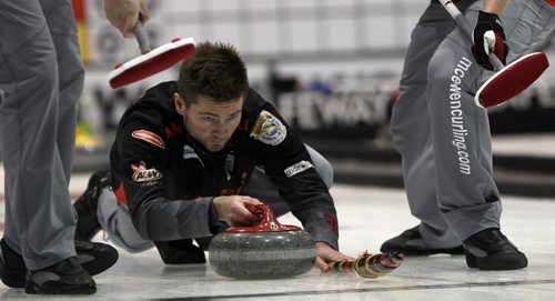 -Draw 6 of the 2014 Safeway Championships at the MTS Iceplex in Winnipeg Thursday afternoon  Mike McEwen from the Fort Rouge CC throws during game against skip Kelly Robertson from Neepawa-See Paul Wiecek story- Jan 30, 2014   (JOE BRYKSA / WINNIPEG FREE PRESS)