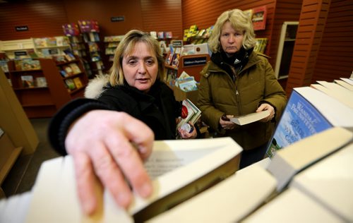 Barb Polson and Carol Douglas shop at Hull's Family Book Store, which is closing its Winnipeg store after 95 years in business, Thursday, January 30, 2014. (TREVOR HAGAN/WINNIPEG FREE PRESS) - see McNeill story