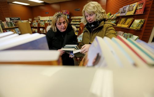 Barb Polson and Carol Douglas shop at Hull's Family Book Store, which is closing its Winnipeg store after 95 years in business, Thursday, January 30, 2014. (TREVOR HAGAN/WINNIPEG FREE PRESS) - see McNeill story