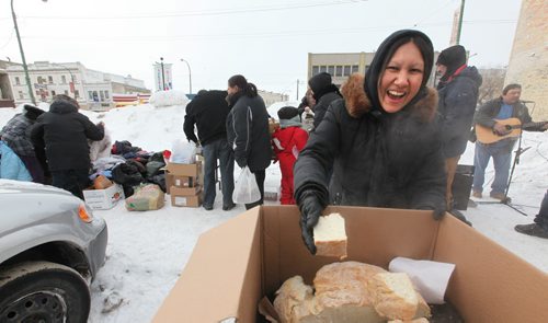 One year ago today  single mom Althea Guiboche started to feed the hungry on the streets of Winnipeg with her trademark bannock. One year later she set up in a parking lot on Main Street at Neechi Foods giving out bannock, food and clothing with a smile.  .Jan 30,, 2014 Ruth Bonneville / Winnipeg Free Press