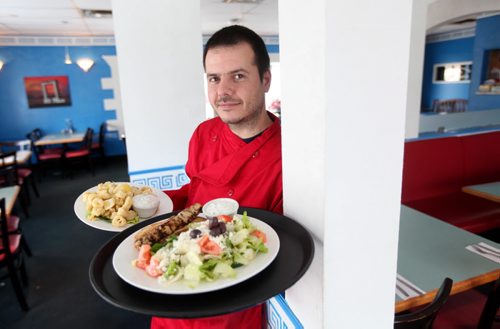 Olympia Diner on Portage Ave. Andrew Spiridakos - serves the house specialities - Chicken Souvlaki and Squid at his family restaurant.    See Dave Sanderson Story.  .  Jan 30,, 2014 Ruth Bonneville / Winnipeg Free Press
