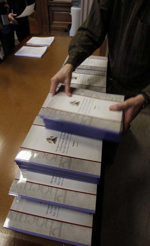The three volumes of The Legacy of Phoenix Sinclair, Achieving the Best for All Our Children report by The Hon. Ted Hughes are handed out to reporters Friday morning.  Wayne Glowacki / Winnipeg Free Press Jan.31  2014