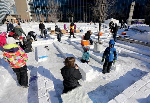 A snow maze being assembled at the Millennium Library, Saturday, February 1, 2014. (TREVOR HAGAN/WINNIPEG FREE PRESS)