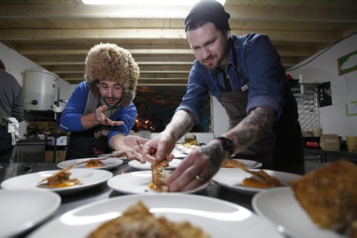 February 1, 2014 - 140201  - Chef Mandel Hitzer (L) and Chef Adam Donnelly finish off appetizers at RAW:almond in Winnipeg Saturday, February 1, 2014. Hitzer, plans to sleep on the ice throughout the restaurants three-week run, to raise money for three community organizations he holds dear: Boys and Girls Clubs of Winnipeg, FortWhyte Alive and Resource Centre for Manitobans who are Deaf-Blind. For the community minded Hitzer this charitable adventure is a natural way to utilize the platform of RAW:almond and give back to Winnipeg. John Woods / Winnipeg Free Press