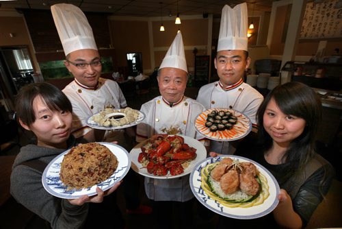 Summer Palace Review, See Marion Warhaft's story. Left to right Lulu Zhai, Song Ni, chef Peter Ho, Yi Yang, Summer Bai  hold respectively Sticky Rice, Dumplings, Lobster Platter, SHrimp Rolls and Cuttle Fish  (same platter) and Crab Balls. Feb 3, 2014 - (Phil Hossack / Winnipeg Free Press)