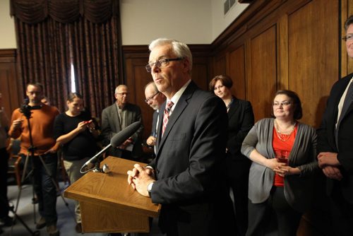 Manitoba Premier Greg Selinger made a s statement today in the cabinet room surrounded by a small potion of his caucus at  the Legislative Building. He announced that Christine Melnick  will be removed from caucus immediately over the recent controversy. - See Bruce Owen and Larry Kusch stories- Feb 04, 2014   (JOE BRYKSA / WINNIPEG FREE PRESS)