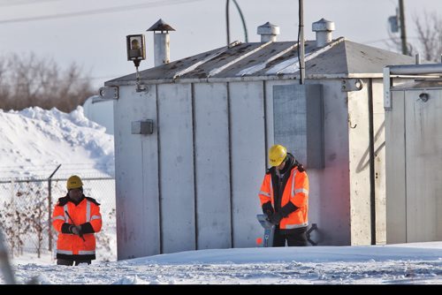 Various crews work on the Plessis Overpass construction site. The project has been delayed again because of an oversite regarding oil pipelines that need to be moved, pushing back construction until the fall of 2015.  140204 - February 04, 2014 MIKE DEAL / WINNIPEG FREE PRESS