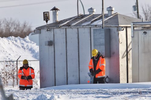 Various crews work on the Plessis Overpass construction site. The project has been delayed again because of an oversite regarding oil pipelines that need to be moved, pushing back construction until the fall of 2015.  140204 - February 04, 2014 MIKE DEAL / WINNIPEG FREE PRESS