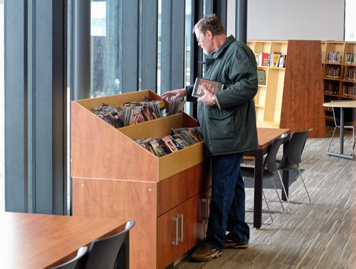 Ted Bakker browses through the DVD selection at the recently opened Gaynor Family Regional Library in Selkirk, Manitoba, with a $1.5 m donation from the Gaynor family. 140204 - February 04, 2014 MIKE DEAL / WINNIPEG FREE PRESS