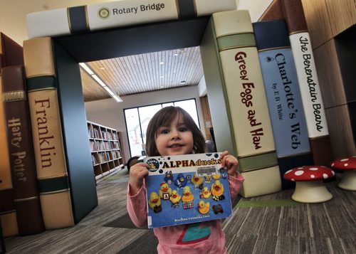 Evy Galashan, 2, shows a favorite book while at the recently opened Gaynor Family Regional Library in Selkirk, Manitoba, with a $1.5 m donation from the Gaynor family. 140204 - February 04, 2014 MIKE DEAL / WINNIPEG FREE PRESS