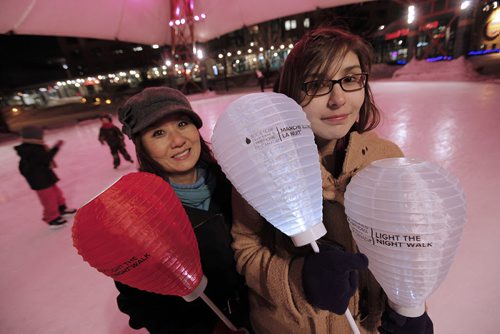 February 4, 2014 - 140204  -  Young-Mi Kwon, executive director prairie region for the Leukemia and Lymphoma Society Of Canada, and the society's 2014 Light the Night Honoured Hero are photographed at their skating evening at The Forks in Winnipeg Tuesday, February 4, 2014. John Woods / Winnipeg Free Press