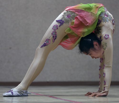 15 year old Zhang Xin Ye from the Sichuan Arts Vocational College in Chengdu, China ( Winnipegs sister city) displays her contortionist abilities during a dress rehearsal before they perform at the Pantages Playhouse Theater this Saturday for the public to celebrate Chinese New Year- the Year of the Wooden Horse - Standup Photo- Feb 05, 2014   (JOE BRYKSA / WINNIPEG FREE PRESS)