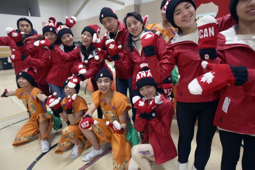 Performers and coaches were Olympic Mitts and Toques presented to them as gifts from Winnipeg- They are from the Sichuan Arts Vocational College in Chengdu, China ( Winnipegs sister city) after a dress rehearsal before they perform at the Pantages Playhouse Theater this Saturday for the public to celebrate Chinese New Year- the Year of the Wooden Horse - Standup Photo- Feb 05, 2014   (JOE BRYKSA / WINNIPEG FREE PRESS)