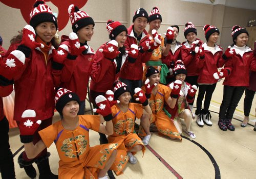 Performers and coaches were Olympic Mitts and Toques presented to them as gifts from Winnipeg- They are from the Sichuan Arts Vocational College in Chengdu, China ( Winnipegs sister city) after a dress rehearsal before they perform at the Pantages Playhouse Theater this Saturday for the public to celebrate Chinese New Year- the Year of the Wooden Horse - Standup Photo- Feb 05, 2014   (JOE BRYKSA / WINNIPEG FREE PRESS)