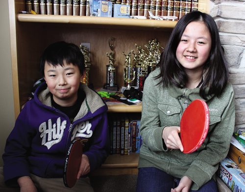 Canstar Community News (30/01/2014)- Jeremy Tran (left), 12, with his older sister Naomi Tran (13) play competitive table tennis. They will be competing and showing their skills at the Manitoba Games come March 2014. (STEPHCROSIER/CANSTARNEWS)