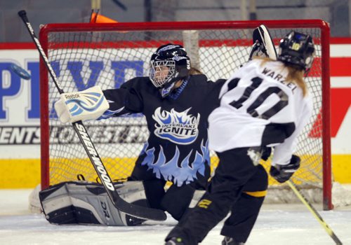 The 5th Annual Boston Pizza / Winnipeg Ringette League All-Star Games and Skills Competition at MTS Centre.  Richmond Stingers Andrea Warzel shoots on Interlake Ignite goalie Shae Mulvihill. Skills competition. BORIS MINKEVICH / WINNIPEG FREE PRESS. FEB 5, 2014