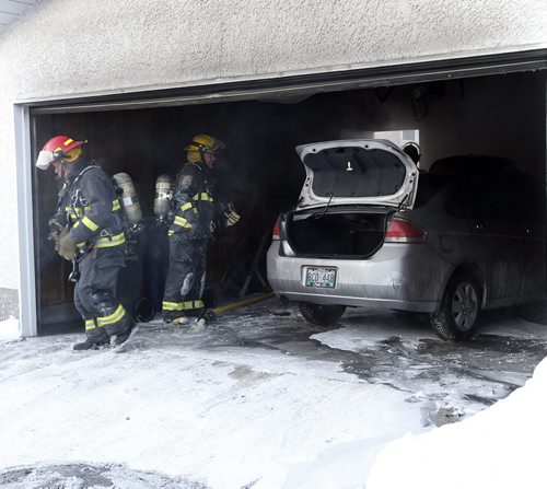Stdup- Garage ,car fire  damaged in the 900 block of Beaverbrook St. -no injuries , Wpg Fire quickly put the fire out  in teh detactched garage for it could spread to the house, the fire may have started in the car . FEB. 6 2014 / KEN GIGLIOTTI / WINNIPEG FREE PRESS