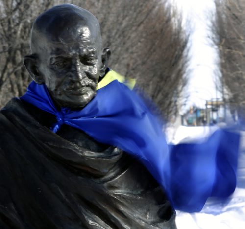 The wind blowing Thursday afternoon made it feel like -25C as it catches the cape tied on to the sculpture of Mahatma Gandhi at The Forks  .  Wayne Glowacki / Winnipeg Free Press Feb.6   2014