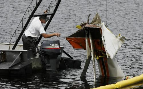 John Woods / Winnipeg Free Press / June 18/07- 070618  - Cliff Dyrkacz removes the tail section of a small plane from West Hawk Lake Monday June 18/07.  RCMP removed the plane that crashed in West Hawk Lake Monday June 11/07.  Two men died in the crash.