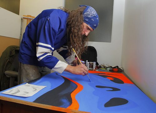 A 24-hour Art-a-thon kicked off is at 1 p.m. today at Artbeat Studio, 62 Albert Street. This evening Marcus Bauer paints. BORIS MINKEVICH / WINNIPEG FREE PRESS. FEB 6, 2014