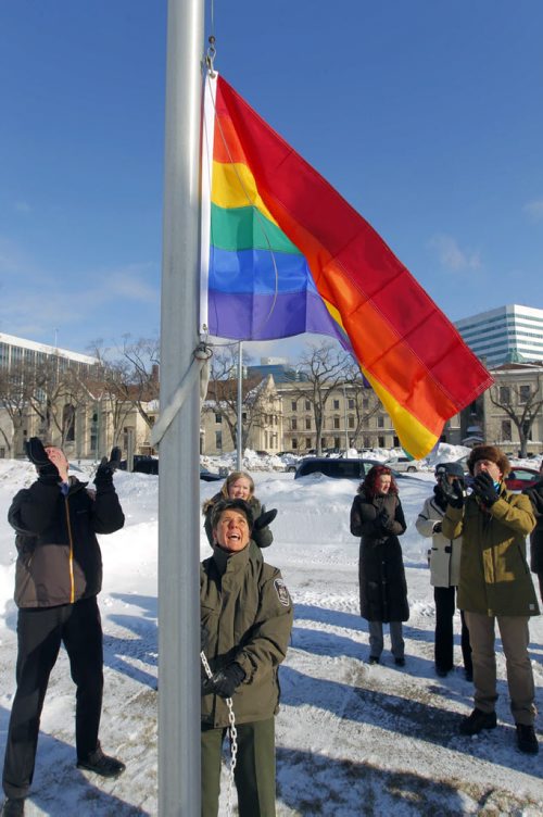 A low key event happened at 12:15 at memorial park. Minister Swan and other NDP members raised a rainbow flag to fly for the duration of the Olympics in solidarity with Russians facing persecution over sexual orientation. BORIS MINKEVICH / WINNIPEG FREE PRESS. FEB 7, 2014