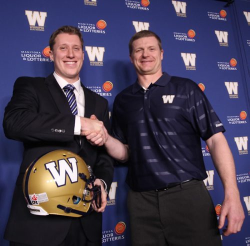 New Winnipeg Blue Bomber pivot Drew Willy, left with head coach Mike OShea, is officially announced as the new starting QB at a news conference Friday afternoon at Investors Group Stadium- The 215 lbs - 6 ft 3 American quarterback played for the University of Buffalo and remains the best passer in school history-    See Paul Wiecek story- Feb 07, 2014   (JOE BRYKSA / WINNIPEG FREE PRESS)