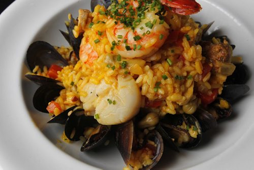 RESTAURANT REVIEW - Fusion Grill - Paella with spicy house made sausage, prawns, chicken, scallops, mussels, artichoke, red pepper, broad beans, Arborio rice and saffron. BORIS MINKEVICH / WINNIPEG FREE PRESS. FEB 7, 2014