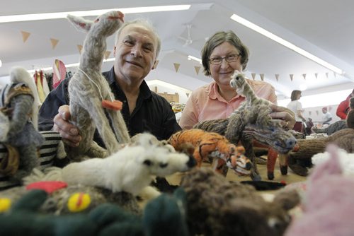 February 8, 2014 - 140208  -  Maurice and Jeanette Dzama show off their needle felted sculptures at the Point Douglas Is For Lovers craft sale at Grace Point Church in Winnipeg Saturday, February 8, 2014. One of the largest toys they made was of Louis Riel on a horse which they donated to WaWa for a fundraiser. Local artisans were on hand to sell their goodies as Valentines gifts and the proceeds go to support Point Douglas development through the Point Douglas Residents' Committee. John Woods / Winnipeg Free Press