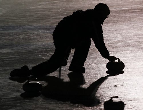 February 8, 2014 - 140208  -  A curler throws at the 13th annual Ironman Outdoor Curling Bonspiel at The Forks in Winnipeg Saturday, February 8, 2014.  John Woods / Winnipeg Free Press