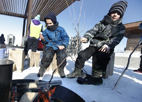 February 9, 2014 - 140209  -  Colby (L) and Jesse Squires toast marshmallows at the fifth annual Snow Trek at Living Prairie Museum in Winnipeg Sunday, February 9, 2014. Participants came out and enjoyed cross-country skiing, snowshoeing, geocaching and snow art. John Woods / Winnipeg Free Press