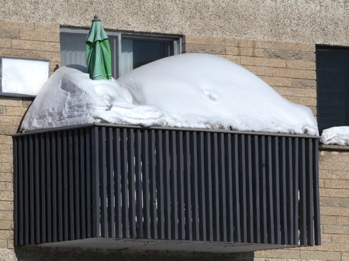 Cancel the patio Party-  A third floor balcony at the Portage Garden apartments on Portage Ave appears to be in the grip of old man winter in Winnipeg Monday-   Standup photo- Feb 10, 2014   (JOE BRYKSA / WINNIPEG FREE PRESS)