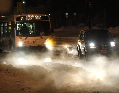 Steam rises from water in a north bound lane on St. Mary's Rd. near Horace St. Tuesday morning after an overnight water main break.   Wayne Glowacki / Winnipeg Free Press Feb. 11   2014