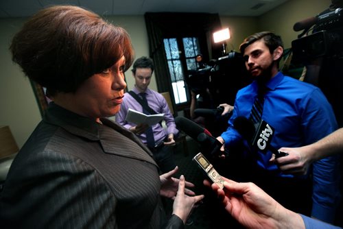 Jobs and the Economy Minister Theresa Oswald reacts to questions regarding the new Federal Budget Tuesday afternoon in her office. See Bruce Owen's story. February 11, 2014 - (Phil Hossack / Winnipeg Free Press)