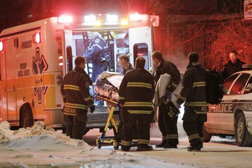 February 11, 2014 - 140211  -  A person is transported to hospital by emergency personnel after responding to an alleged stabbing on Matheson Avenue East in Winnipeg Tuesday, February 11, 2014. John Woods / Winnipeg Free Press