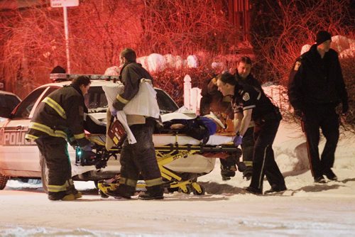 February 11, 2014 - 140211  -  A person is transported to hospital by emergency personnel after responding to an alleged stabbing on Matheson Avenue East in Winnipeg Tuesday, February 11, 2014. John Woods / Winnipeg Free Press